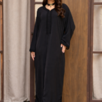 A luxurious Moroccan crepe kaftan with delicate embroidery and an elegant design